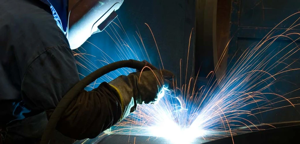A photo of a person welding