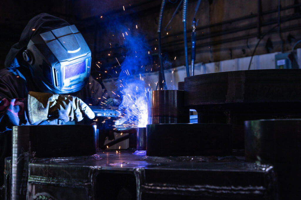 A photo of a welder working on a part